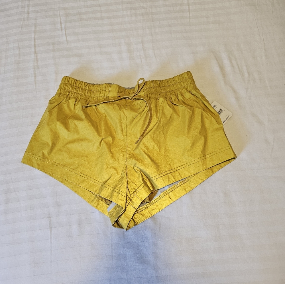 FREE PEOPLE MOVEMENT Reflective running shorts. NWT, gorgeous and bright.